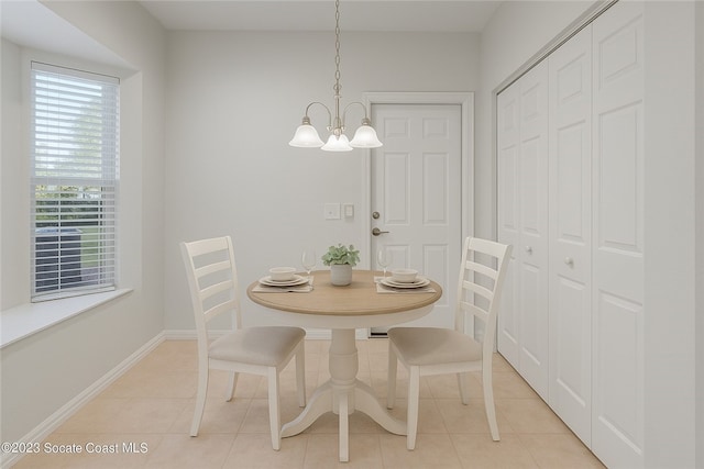 1872 Easthampton Ter, Vero Beach, FL 32966 - dining room featuring a chandelier, light tile patterned floors, and baseboards