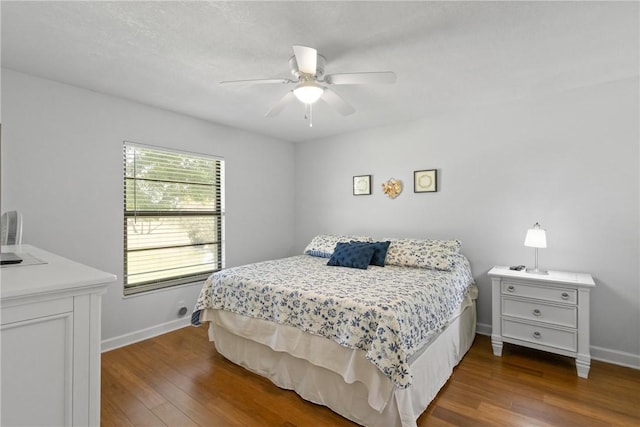 25 Plantation Dr Unit 206, Vero Beach, FL 32966 - bedroom featuring dark wood-style flooring, baseboards, and a ceiling fan