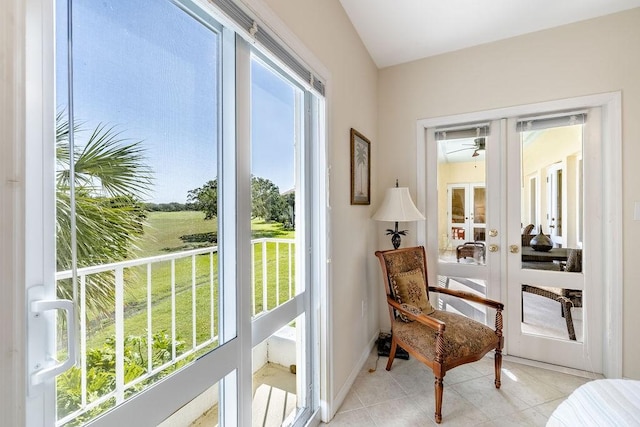 5060 Harmony Cir Unit 204, Vero Beach, FL 32967 - living area with french doors, a ceiling fan, plenty of natural light, and light tile patterned floors