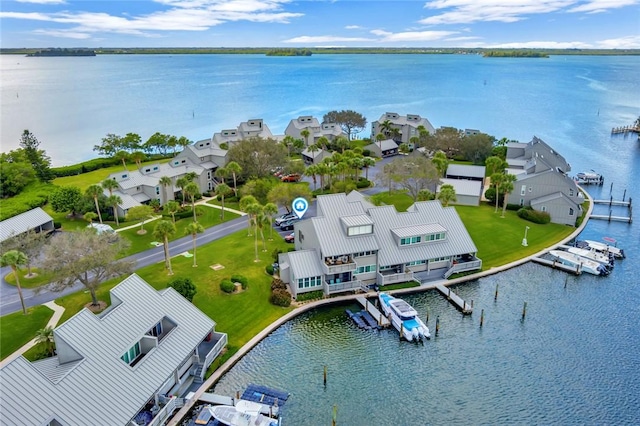 birds eye view of property with a water view