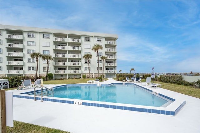 view of pool featuring a patio