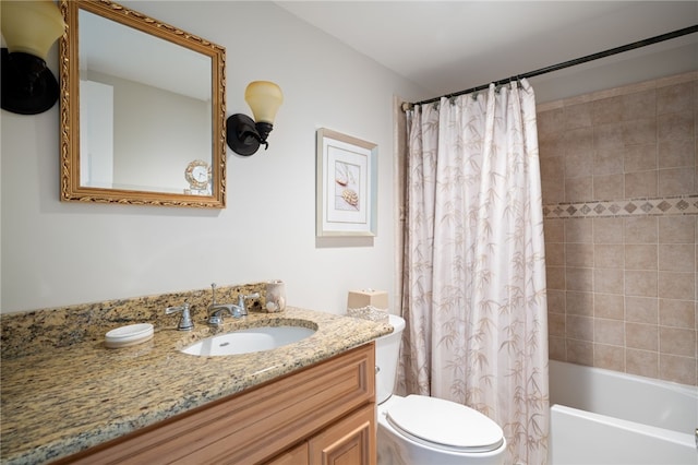 full bathroom featuring vanity, shower / bath combo, and toilet