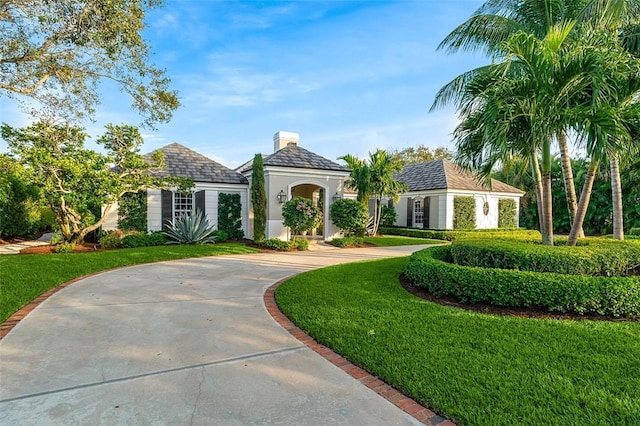 view of front of home with a front lawn