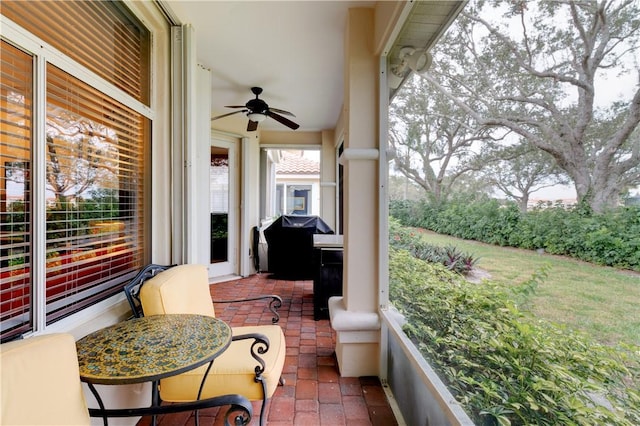 balcony featuring ceiling fan and a grill