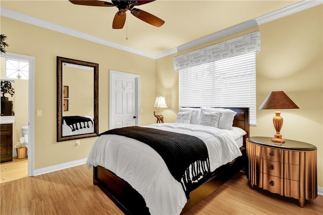 bedroom with ceiling fan, ensuite bathroom, light hardwood / wood-style floors, and ornamental molding