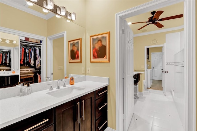 bathroom with ceiling fan, vanity, crown molding, and tile patterned flooring