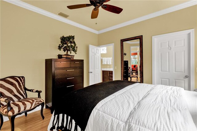 bedroom with ensuite bathroom, ceiling fan, crown molding, and light hardwood / wood-style flooring