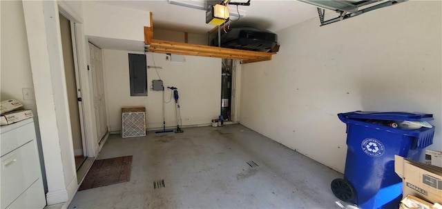 garage with washer / clothes dryer, a garage door opener, and electric panel