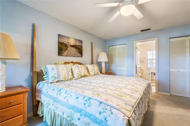 1295 Winding Oaks Cir E Unit 805, Vero Beach, FL 32963 - bedroom with carpet, baseboards, connected bathroom, two closets, and a ceiling fan
