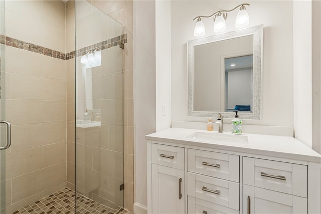 bathroom featuring vanity and an enclosed shower