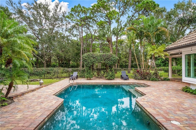 view of swimming pool with a patio, fence private yard, and a fenced in pool