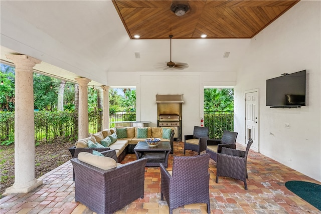 view of patio / terrace featuring visible vents, area for grilling, ceiling fan, fence, and an outdoor living space