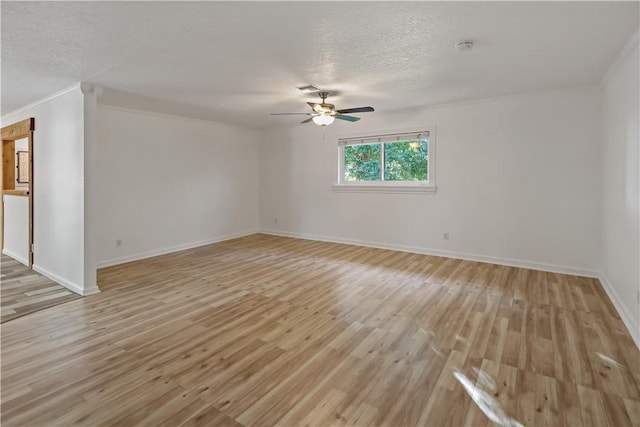 unfurnished room featuring a textured ceiling, baseboards, light wood finished floors, and ceiling fan