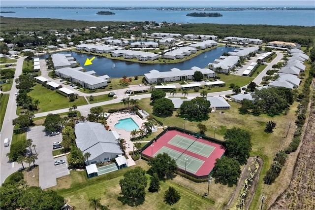 birds eye view of property featuring a water view