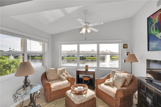 sunroom / solarium featuring a wealth of natural light, ceiling fan, and lofted ceiling