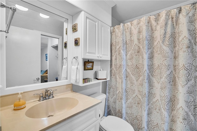 bathroom with vanity and toilet