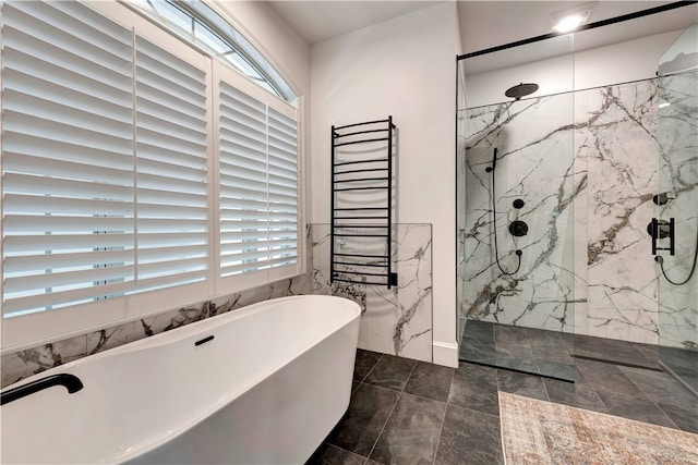 bathroom with shower with separate bathtub, radiator heating unit, and plenty of natural light