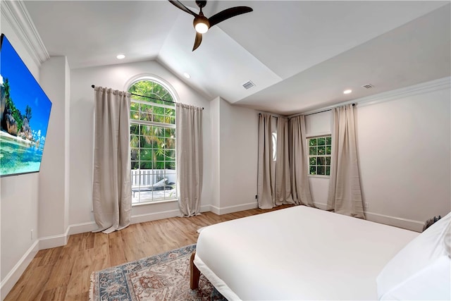 bedroom with light hardwood / wood-style floors, lofted ceiling, and ceiling fan