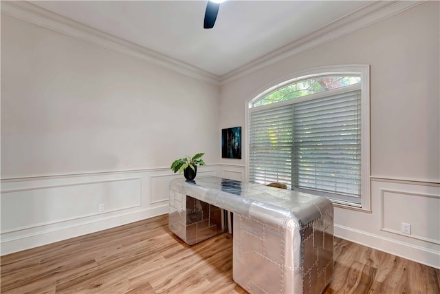 office space with ornamental molding, ceiling fan, and light hardwood / wood-style floors