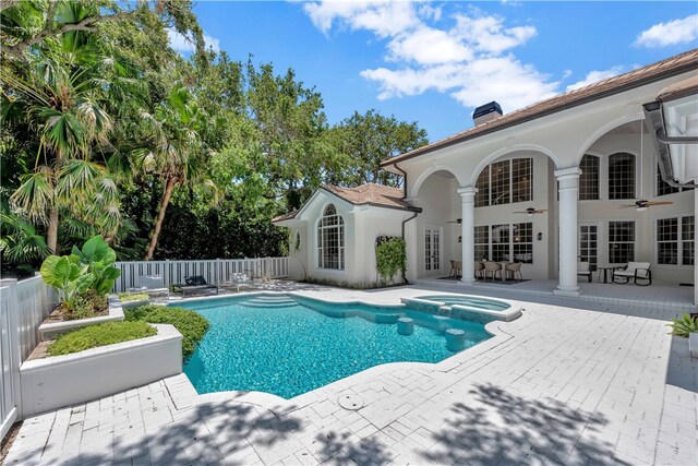 view of pool featuring ceiling fan and a patio