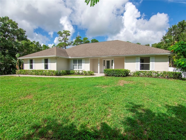 ranch-style house with a front lawn