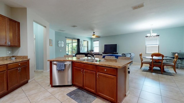 138 Port Royal Ct, Sebastian, FL 32958 - kitchen featuring dishwasher, light countertops, light tile patterned floors, and a chandelier