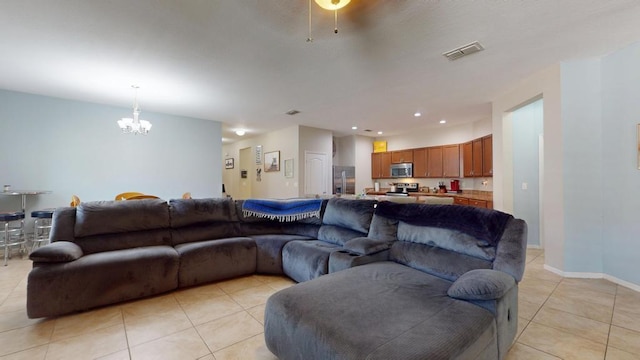 138 Port Royal Ct, Sebastian, FL 32958 - living area with a chandelier, light tile patterned floors, and recessed lighting