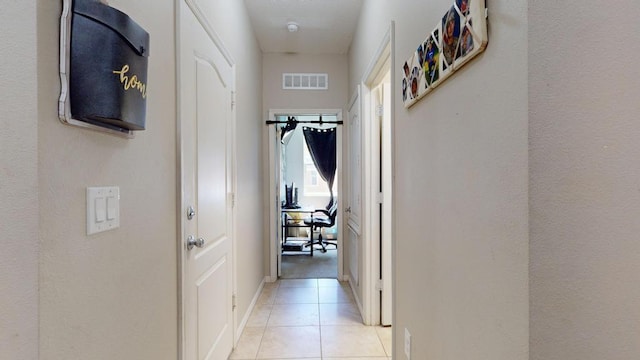 138 Port Royal Ct, Sebastian, FL 32958 - hall with light tile patterned floors and baseboards