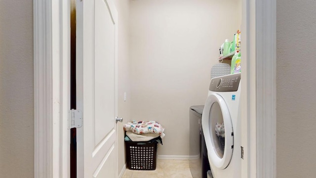 138 Port Royal Ct, Sebastian, FL 32958 - washroom with washer / dryer and light tile patterned floors