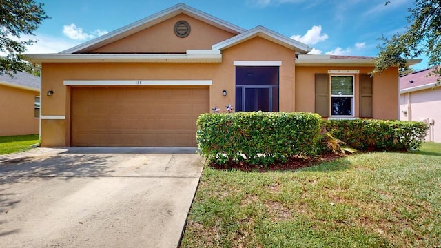 138 Port Royal Ct, Sebastian, FL 32958 - view of front of home with stucco siding, an attached garage, a front yard, and concrete driveway