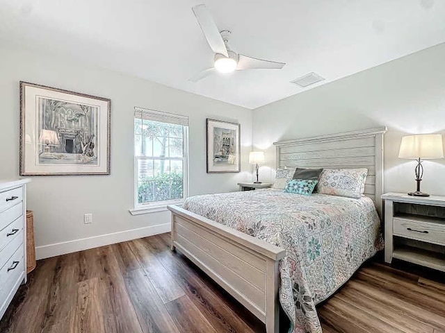 bedroom with dark wood-type flooring and ceiling fan