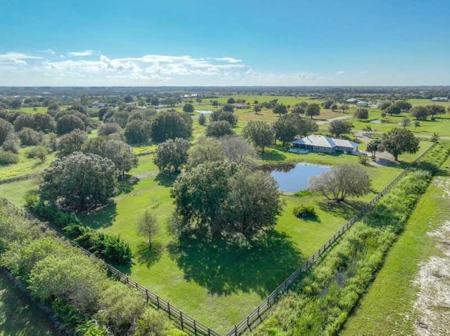 birds eye view of property with a rural view and a water view