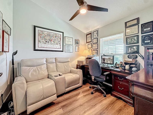 office featuring light wood-type flooring, lofted ceiling, and ceiling fan