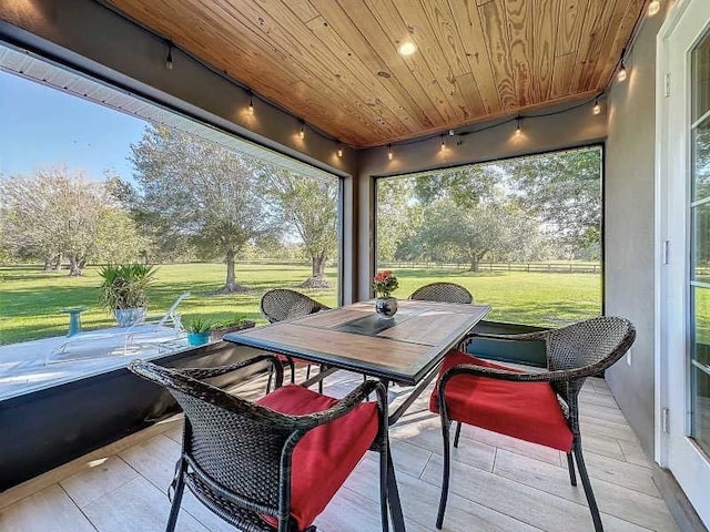 sunroom featuring wood ceiling