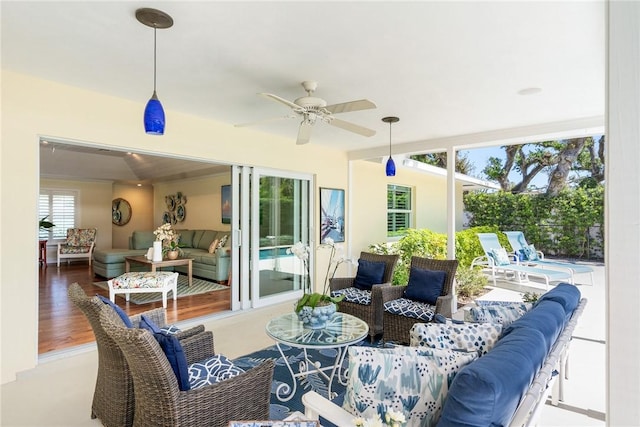 view of patio with outdoor lounge area and a ceiling fan