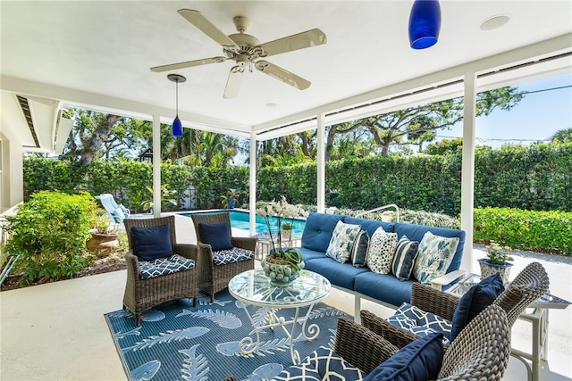 view of patio / terrace featuring a fenced in pool, a ceiling fan, a fenced backyard, and outdoor lounge area