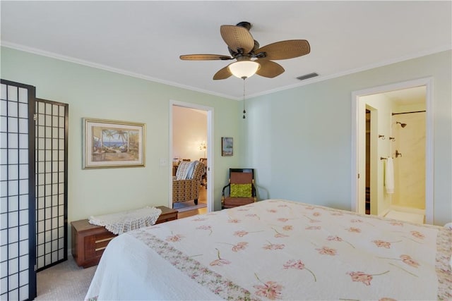 bedroom featuring ceiling fan, a spacious closet, ensuite bathroom, crown molding, and carpet