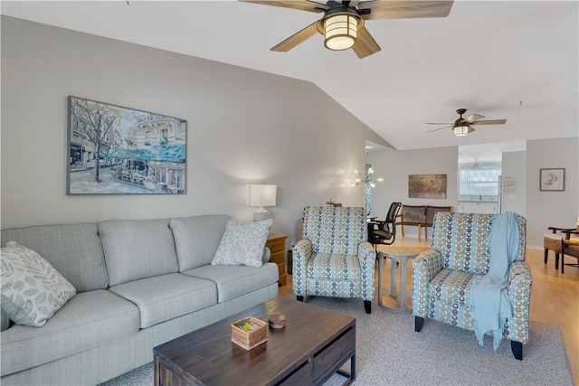 living room with light wood-type flooring, vaulted ceiling, and ceiling fan