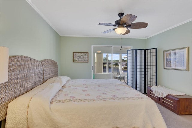 carpeted bedroom with ceiling fan and ornamental molding