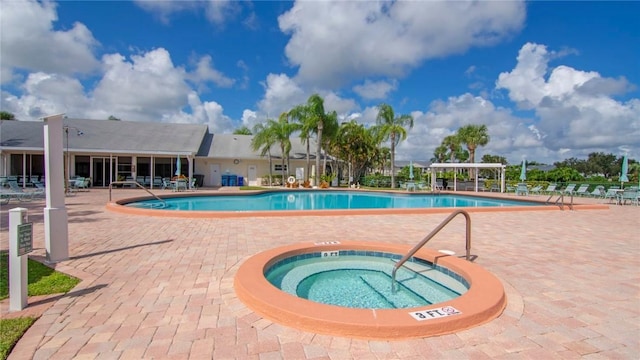 view of pool featuring a community hot tub