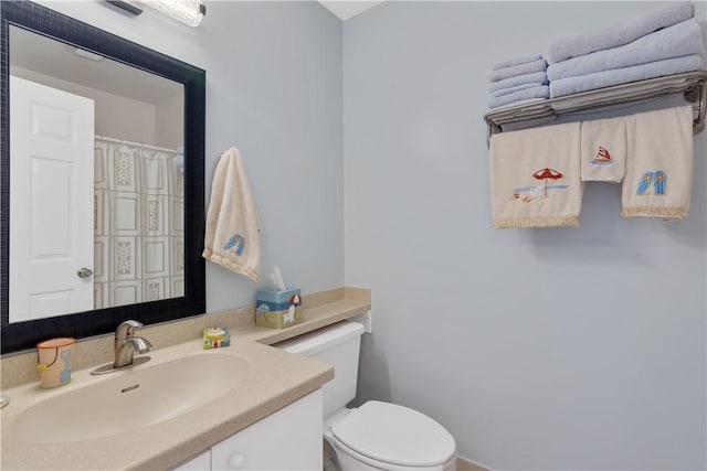 bathroom with vanity and toilet