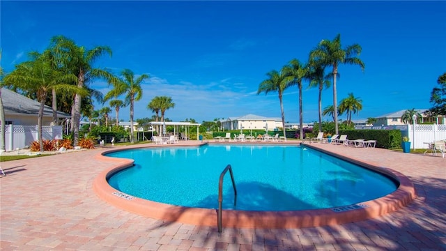 view of swimming pool featuring a patio area