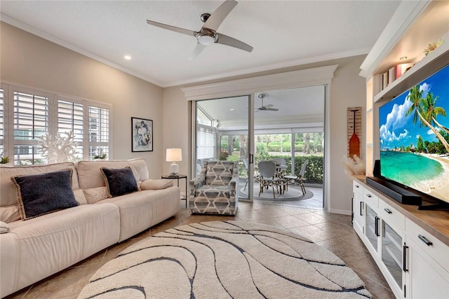 living room featuring ornamental molding and a ceiling fan