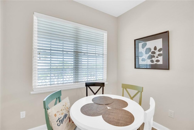 dining room featuring baseboards