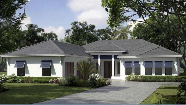 7625 N Polo Grounds Ln, Vero Beach, FL 32966 - ranch-style home with a front yard and stucco siding