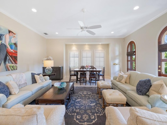 living room with a ceiling fan, recessed lighting, visible vents, and crown molding