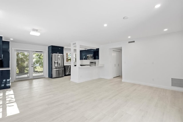 unfurnished living room featuring light wood-type flooring