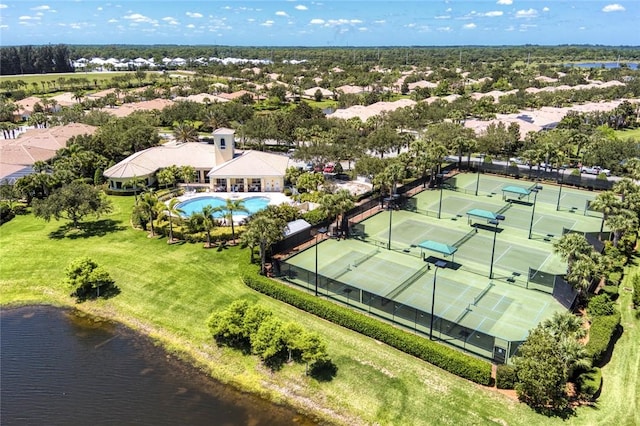 aerial view of a pool and a large body of water