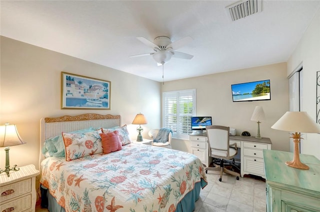 bedroom featuring a desk, a ceiling fan, and light tile patterned flooring