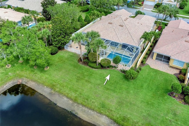 aerial view of residential area featuring a large body of water